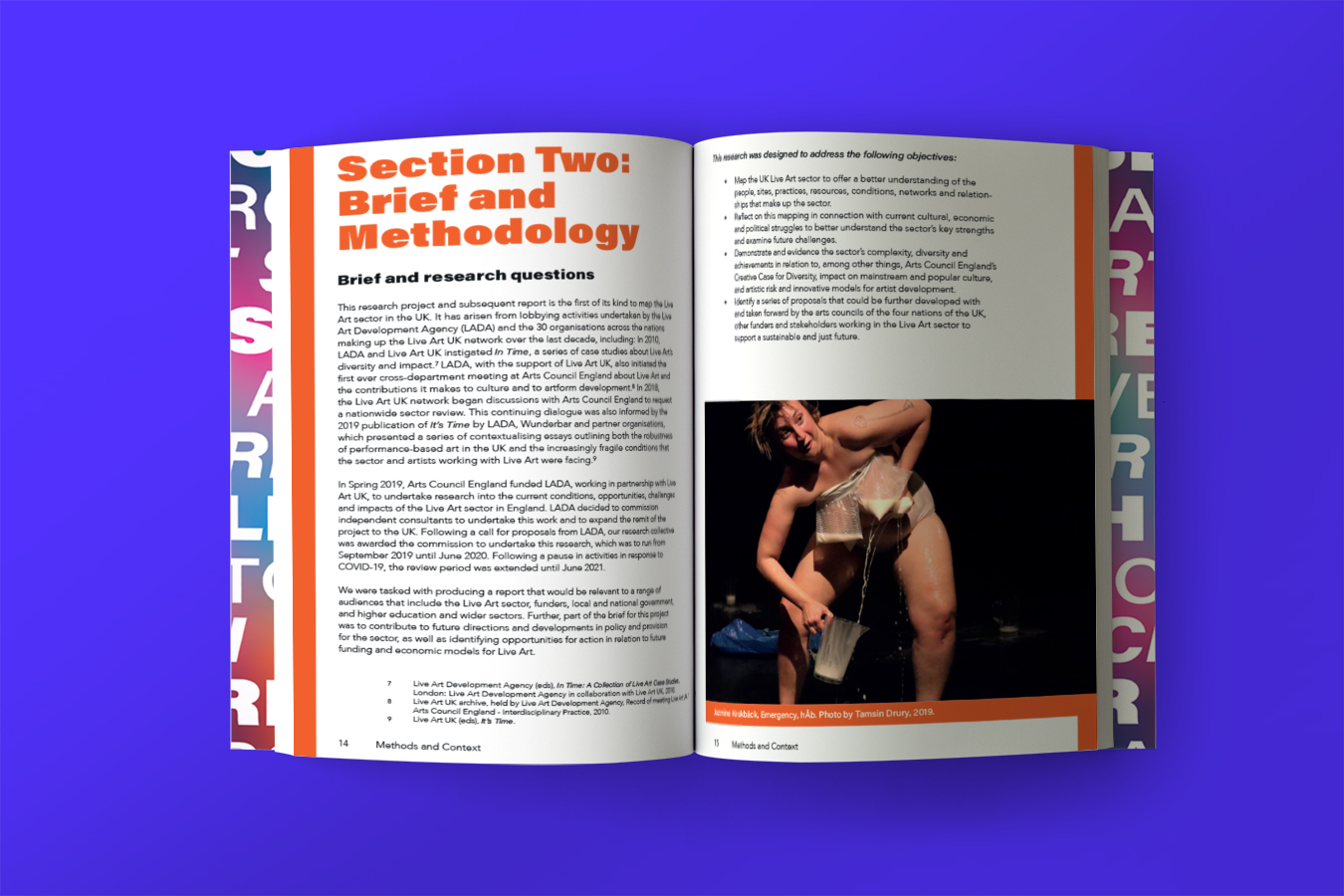 The Live Art Sector Research book spread open, the left page shows orange and black text on a white background, the right has text and an image taken from a performance of a person with bags of milk taped to their chest, squirting milk into a jug.